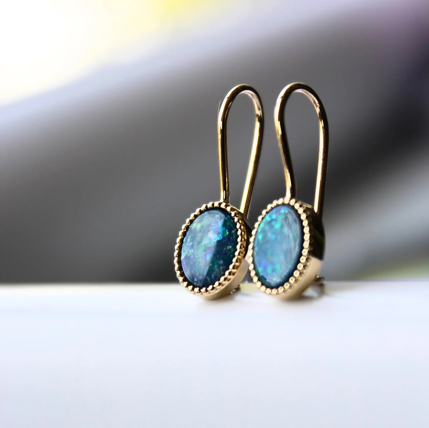 Gold Earrings with Oval cut Opal