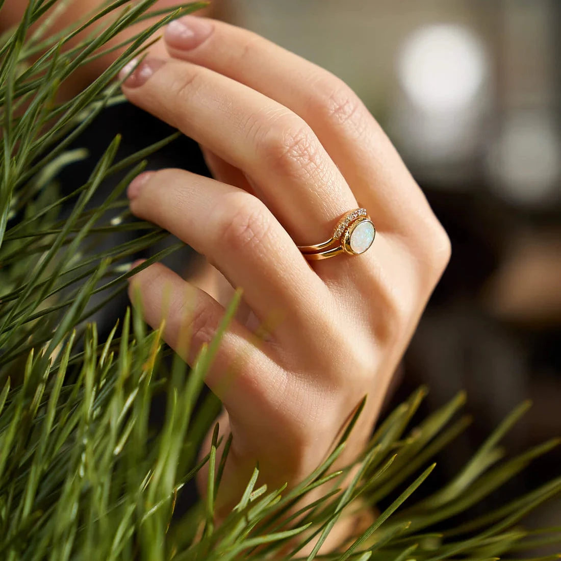 Gold Ring set with Oval cut Opal and Diamonds
