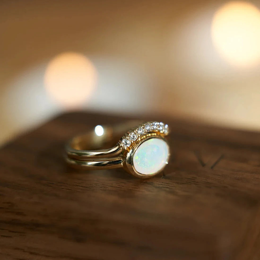 Gold Ring set with Oval cut Opal and Diamonds