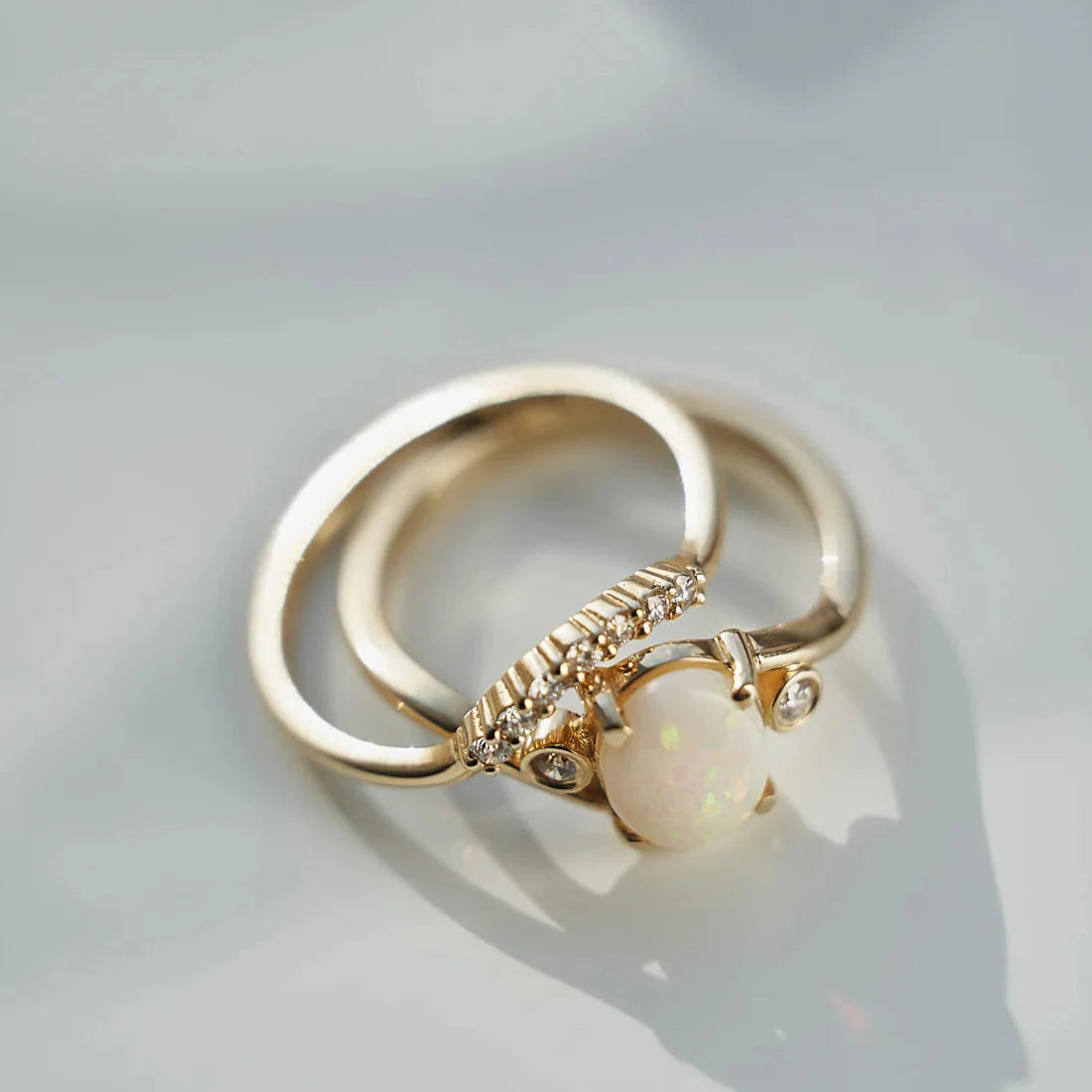 Gold Ring set with Oval cut Opal and Diamonds