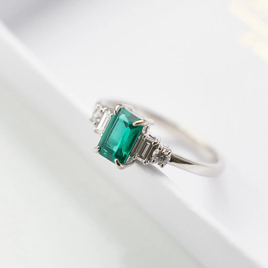 Gold Ring with Emerald cut Emerald and Diamonds