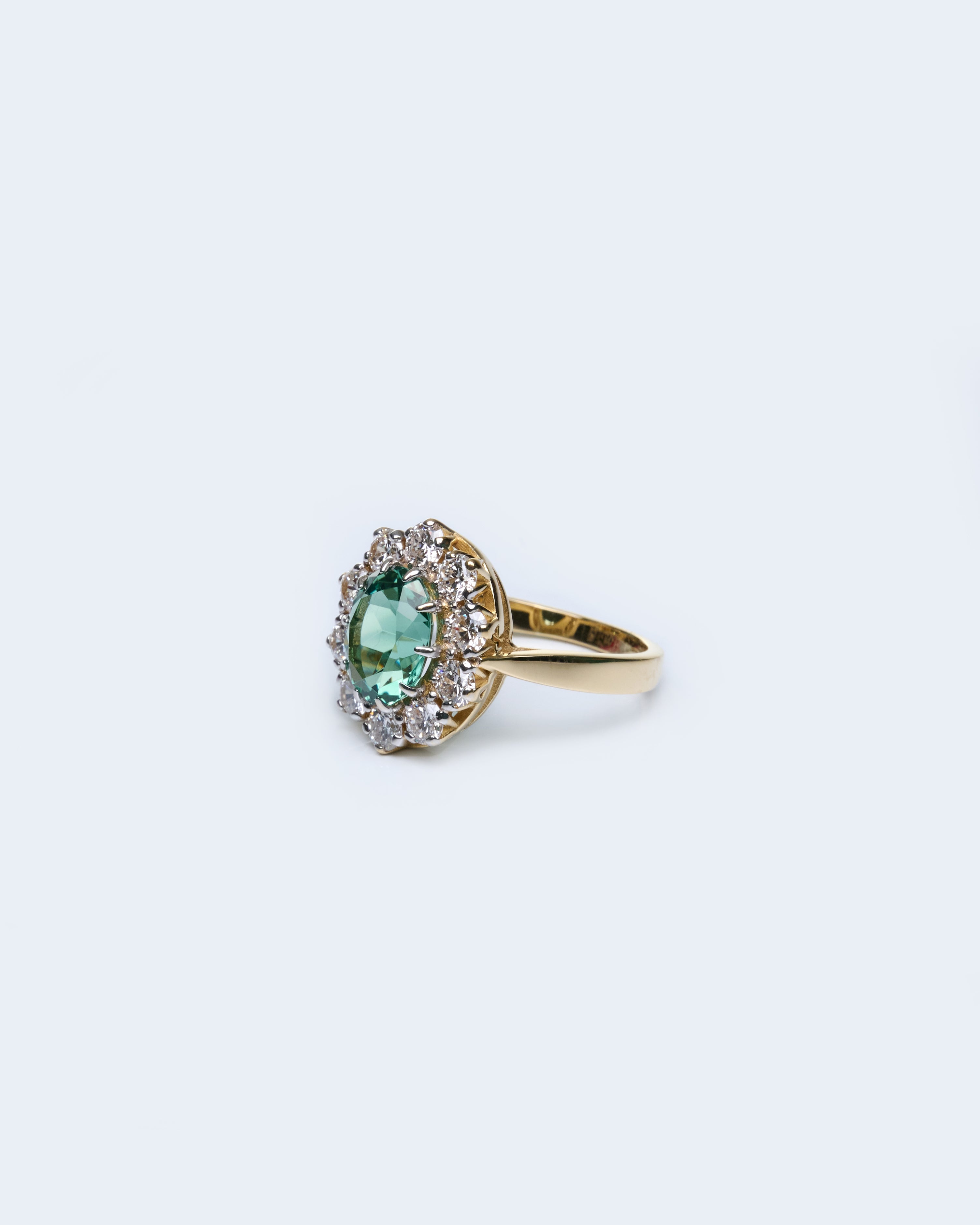 Gold Ring with Oval Green Sapphire and Round Diamonds