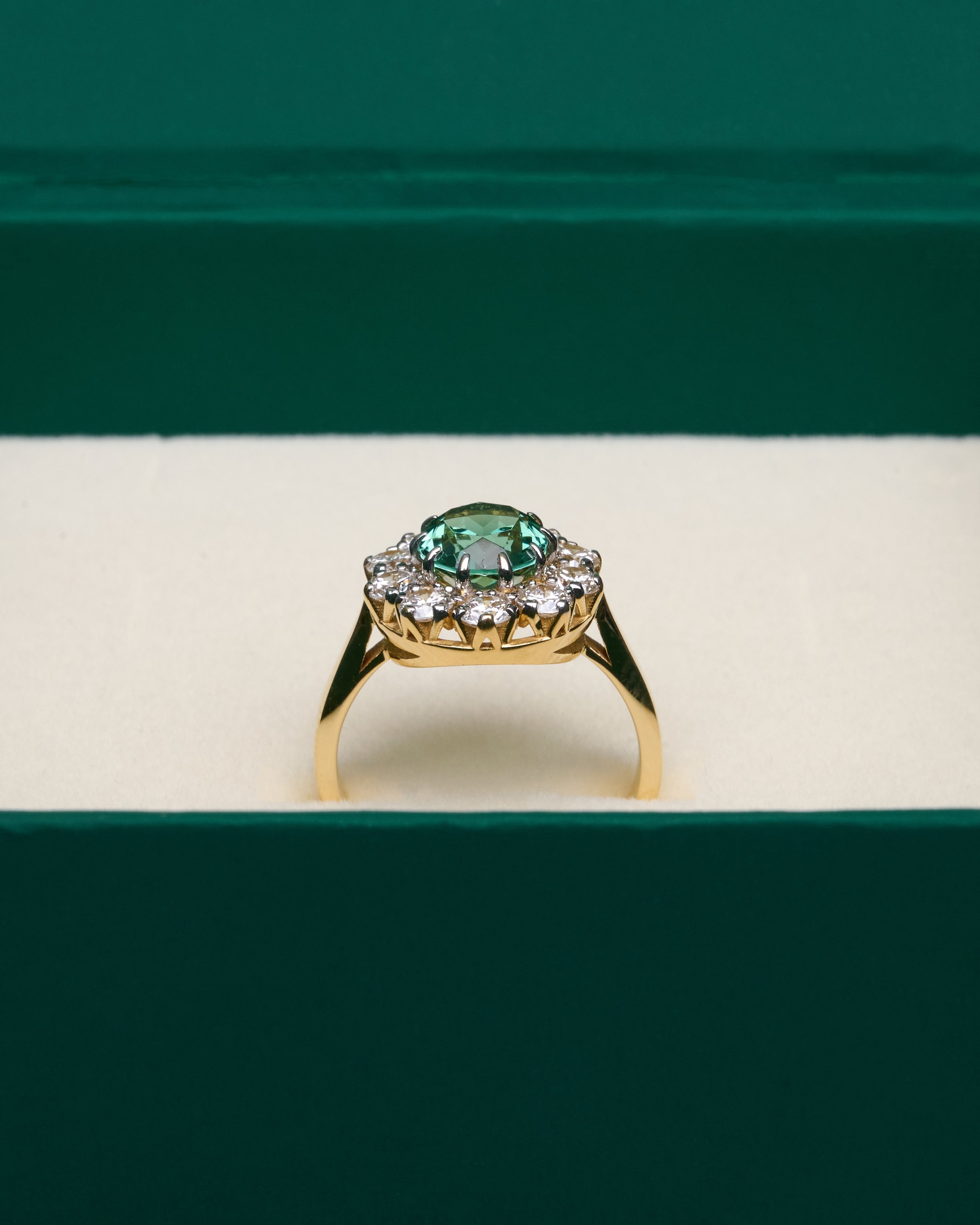 Gold Ring with Oval Green Sapphire and Round Diamonds