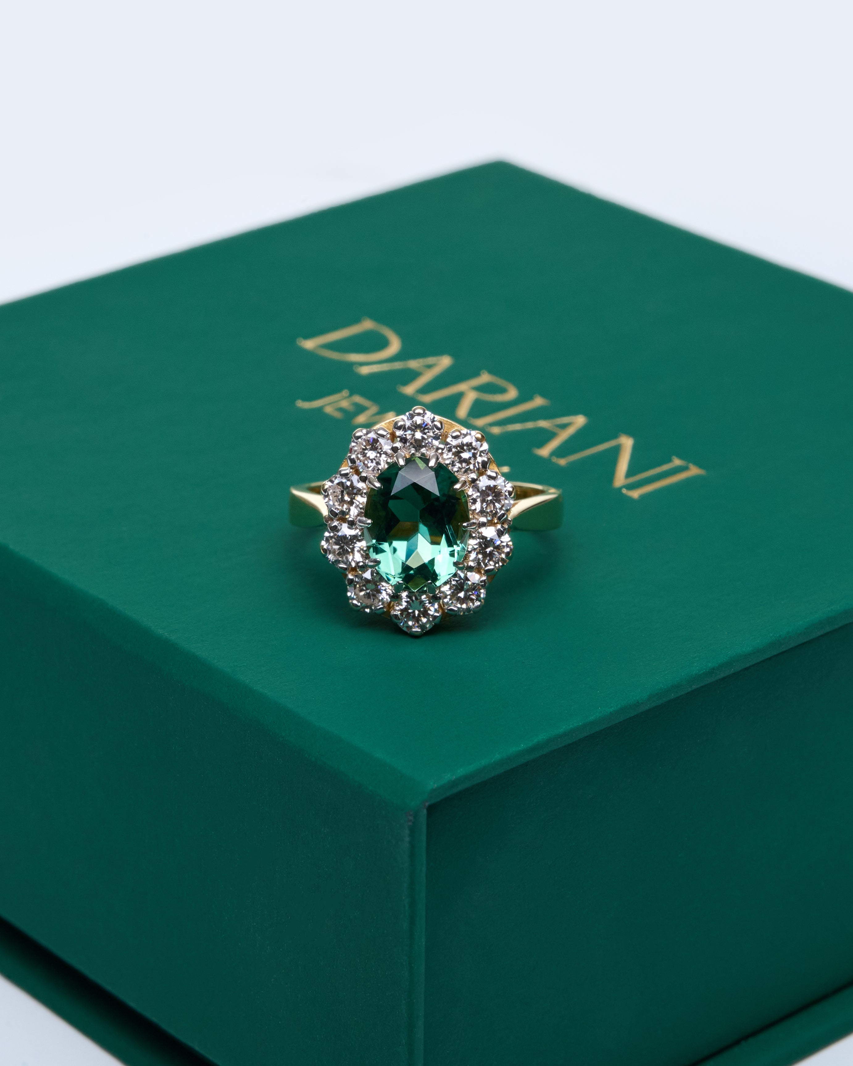 Gold Ring with Oval Green Sapphire and Round Diamonds