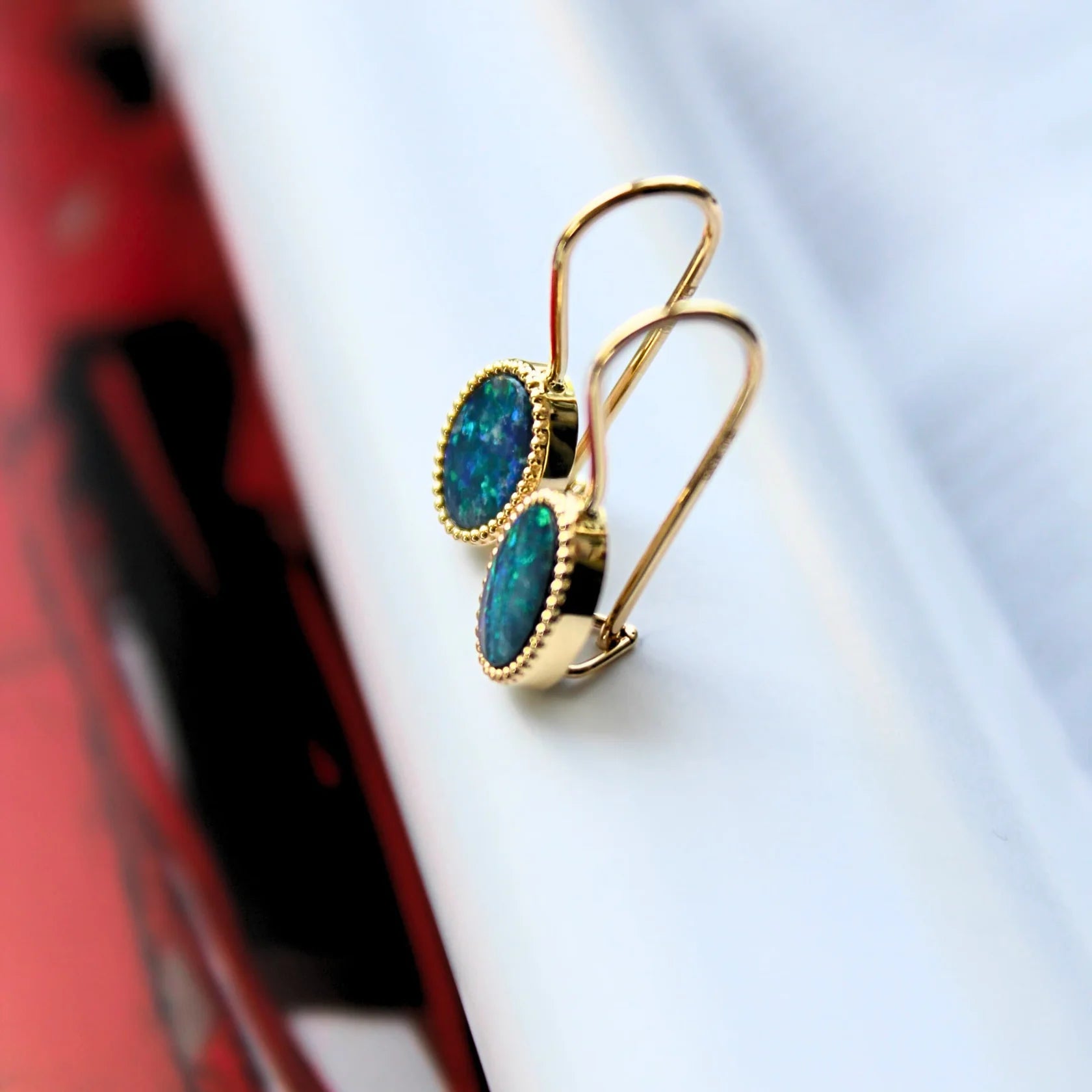 Gold Earrings with Oval cut Opal