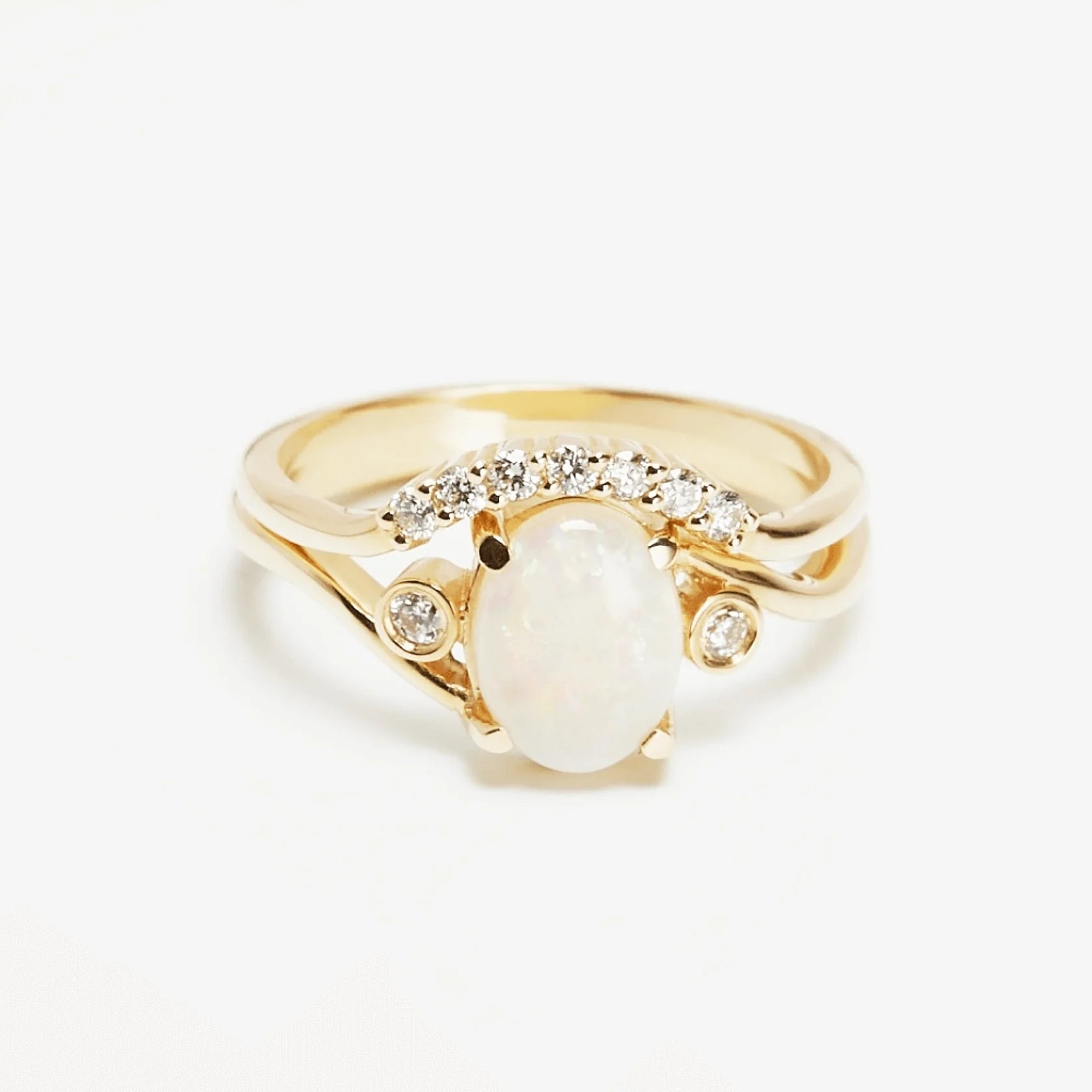 Gold Ring set with Oval cut Opal and Diamonds
