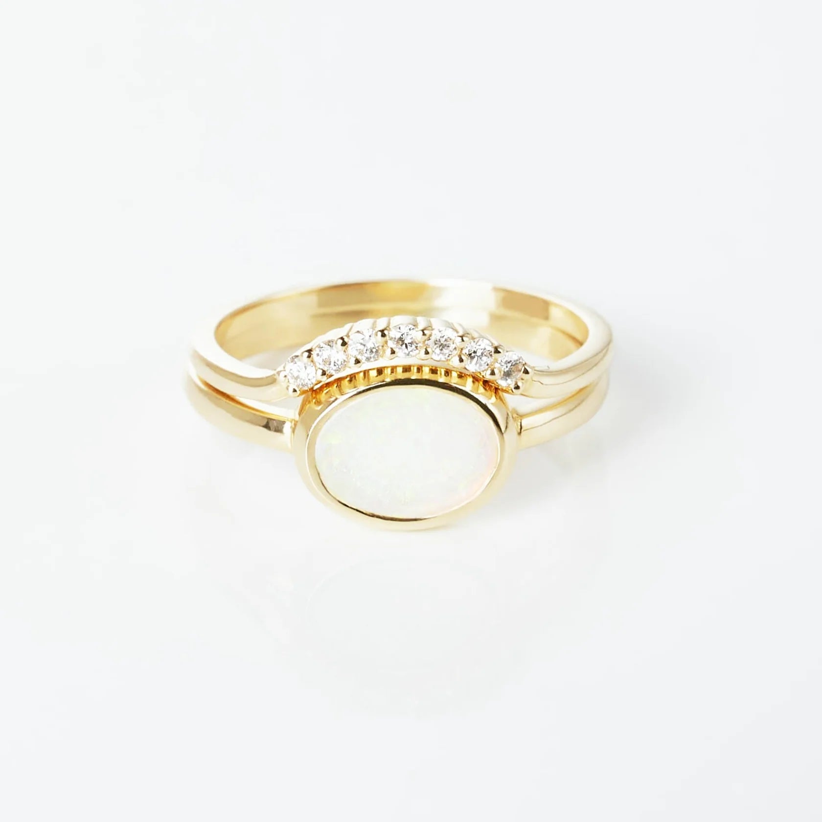 Gold Ring set with Oval cut Opal and Diamonds