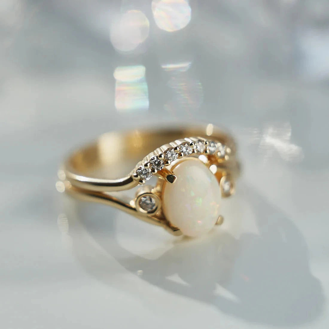 Gold Ring set with Oval cut Opal and Diamonds