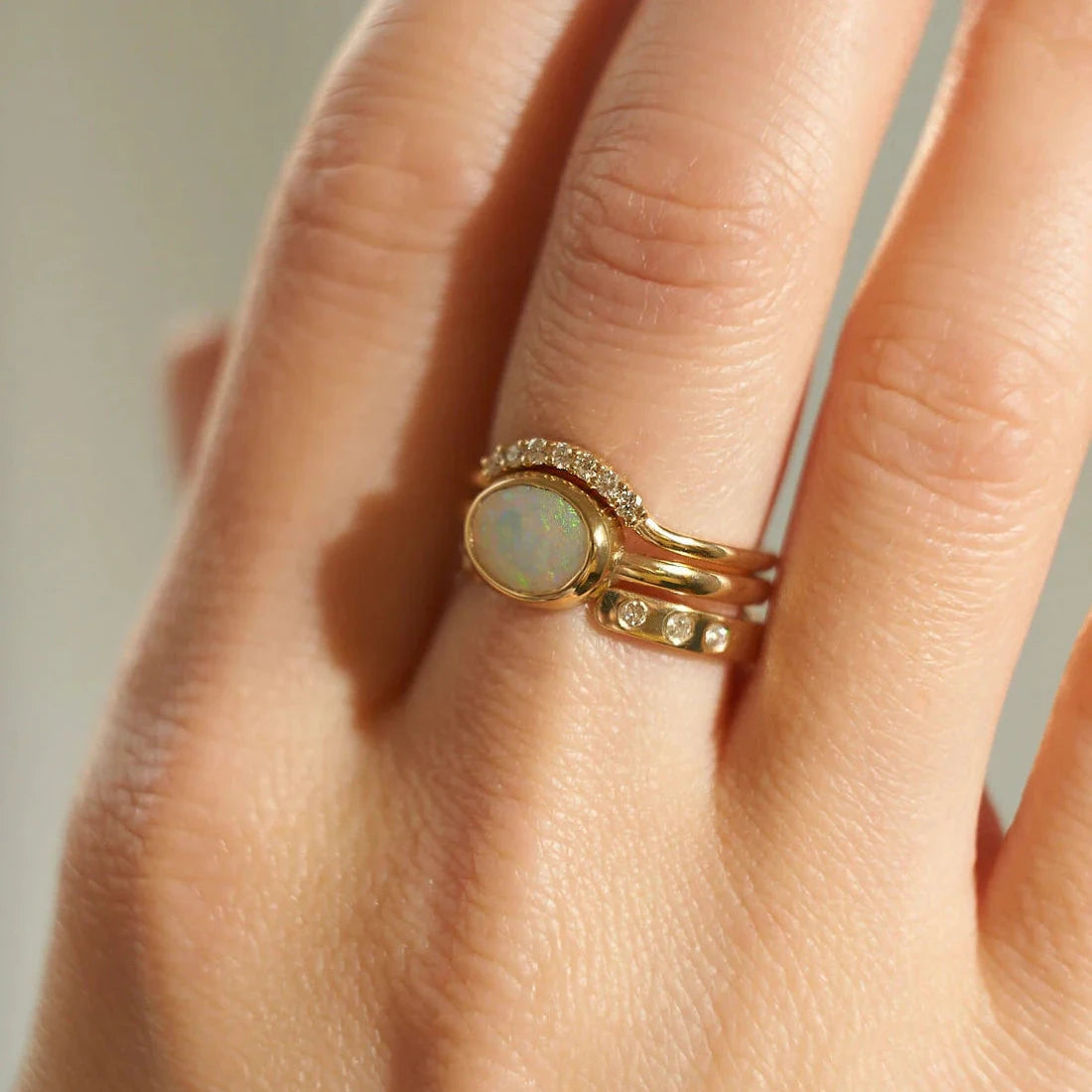 Gold Rings set with Oval cut Opal and Diamonds