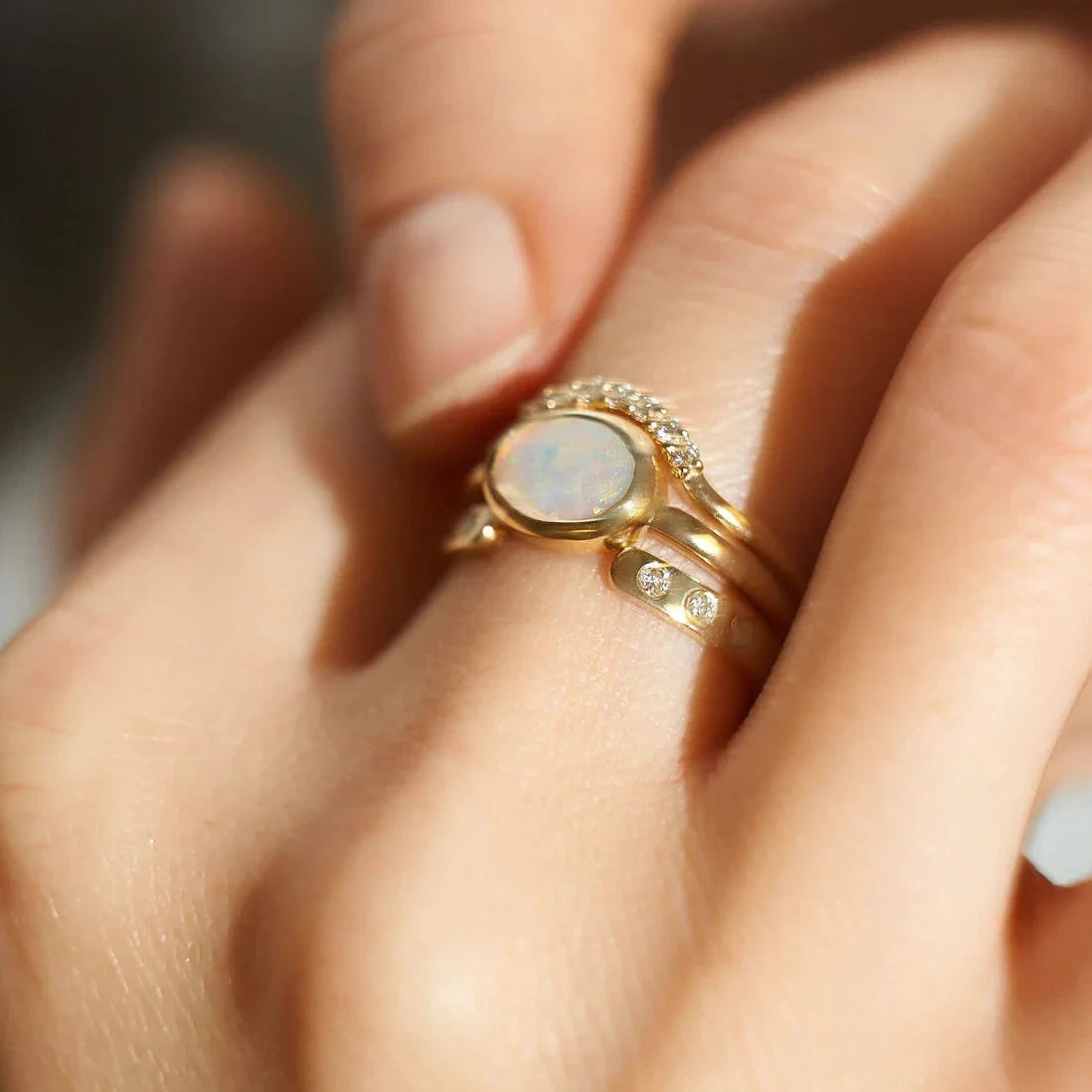 Gold Rings set with Oval cut Opal and Diamonds