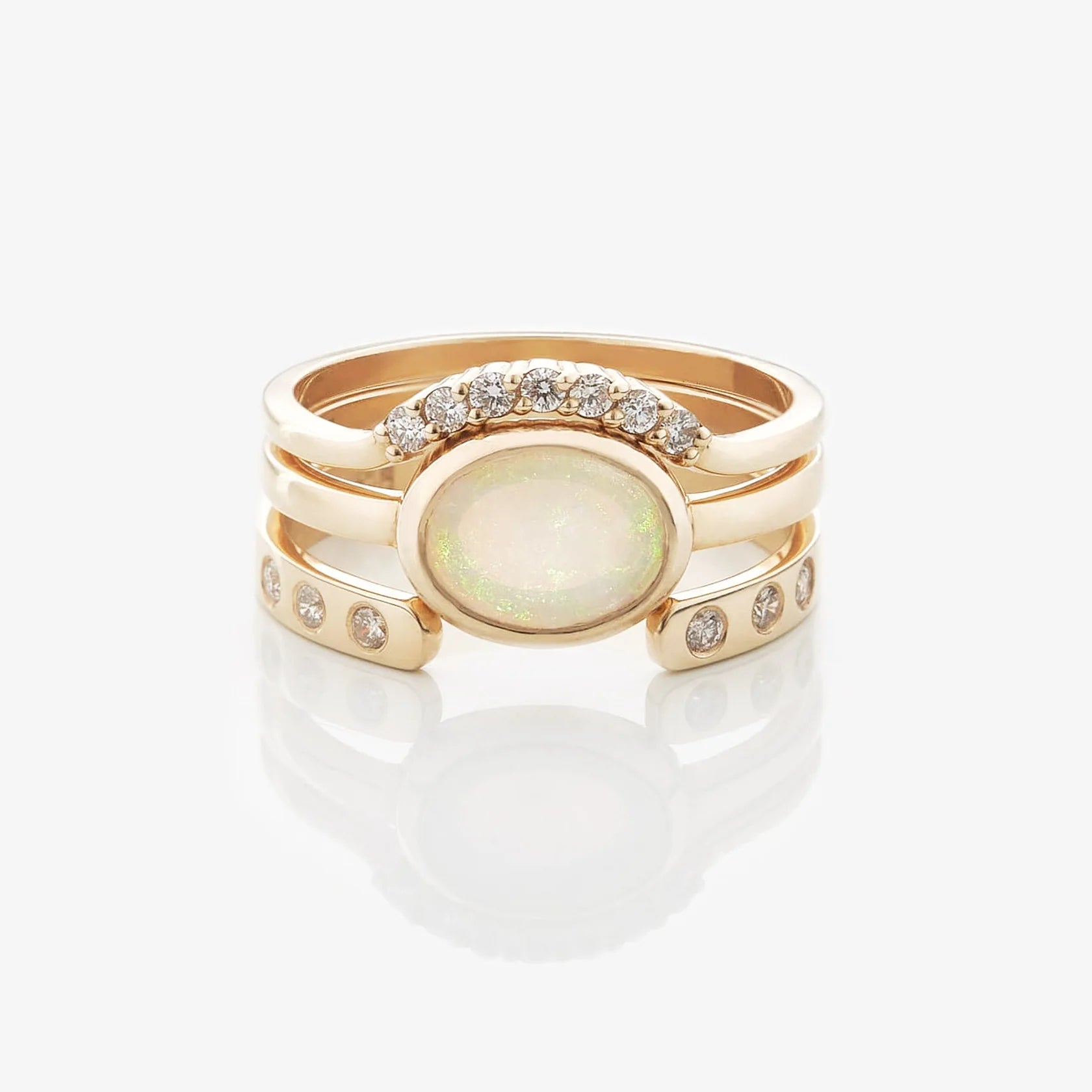 Gold Rings set with Oval cut Opal and Diamonds
