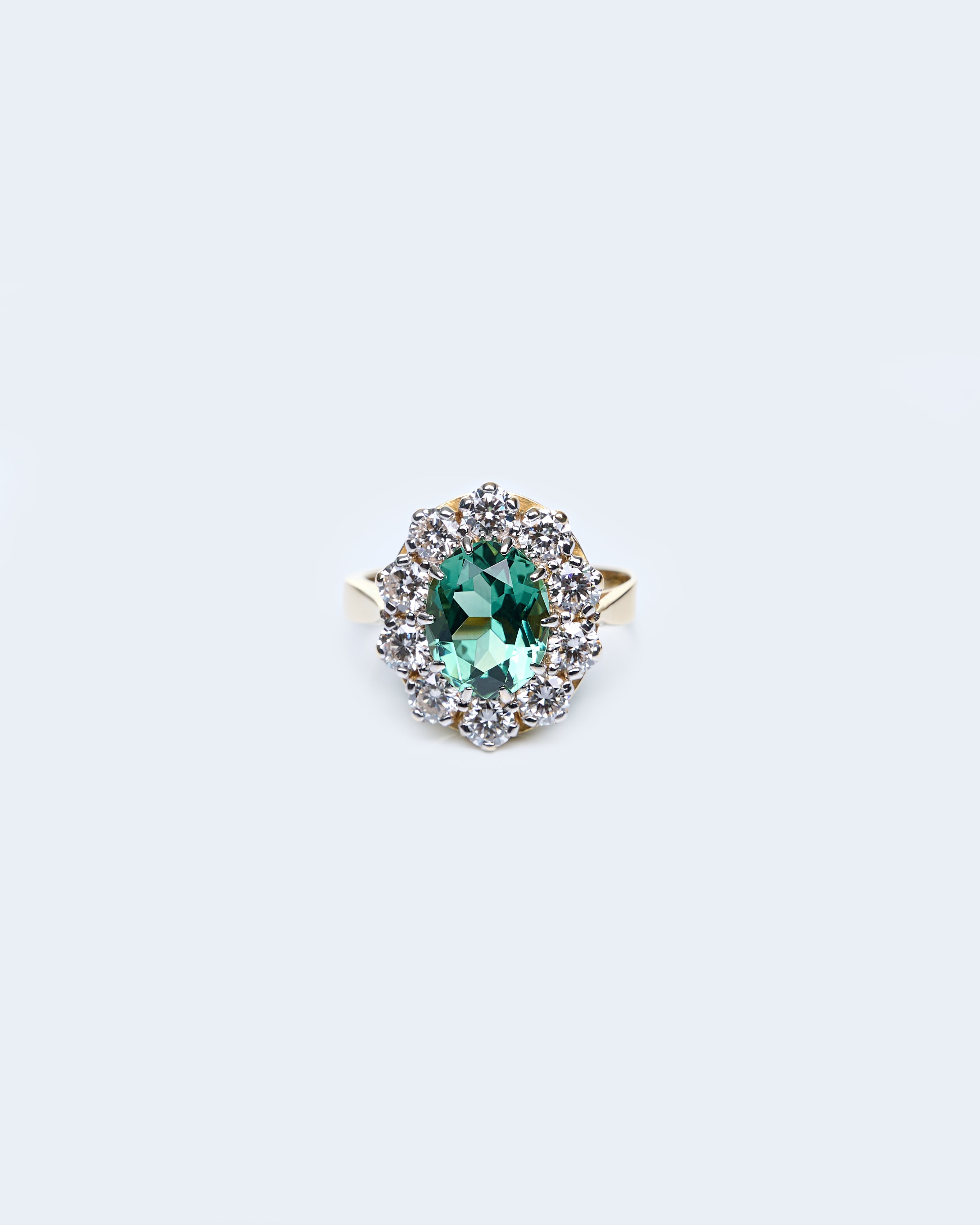 Gold Ring with Oval Green Sapphire and Round Diamonds
