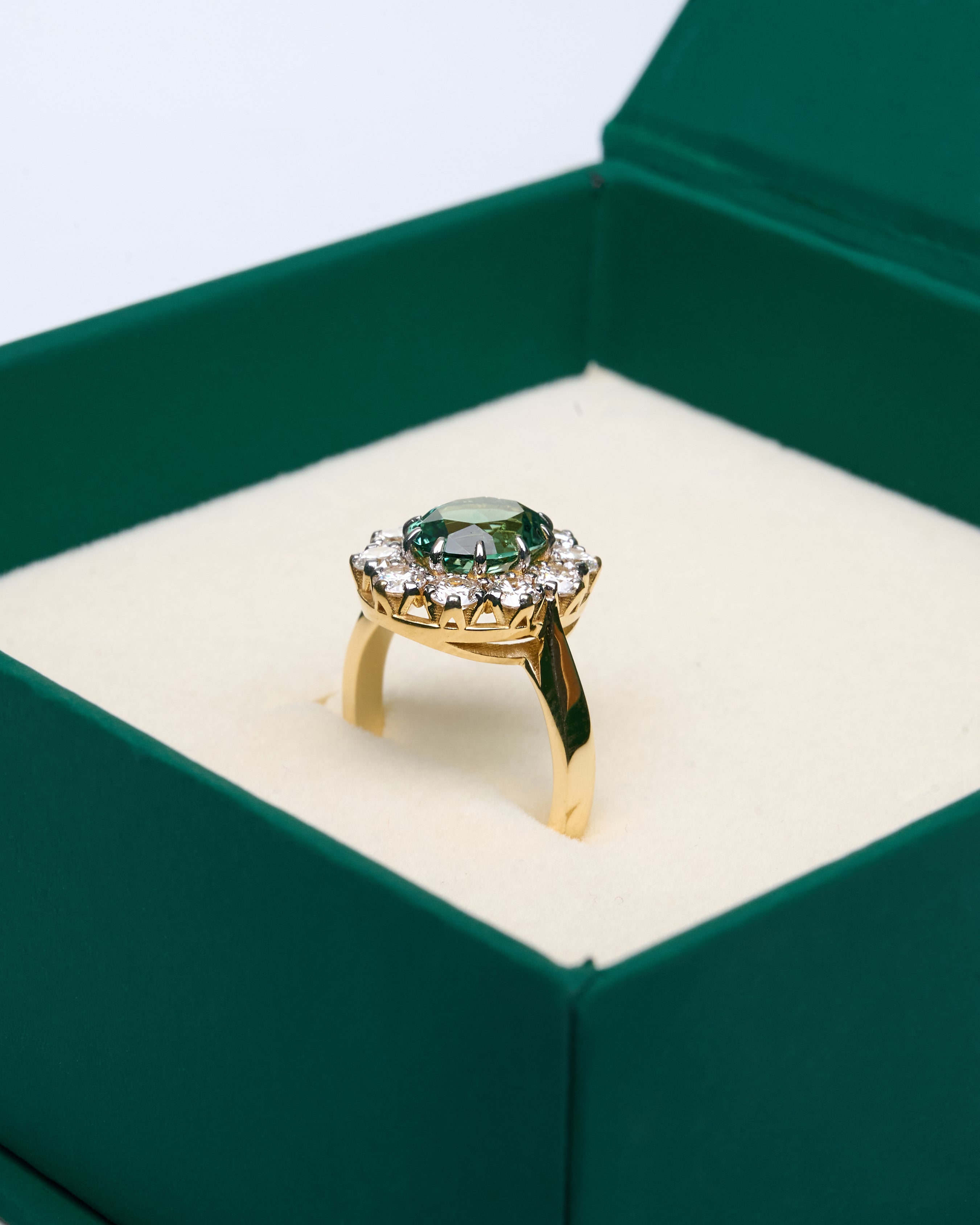 Gold Ring with Oval Green Sapphire and Round Diamonds