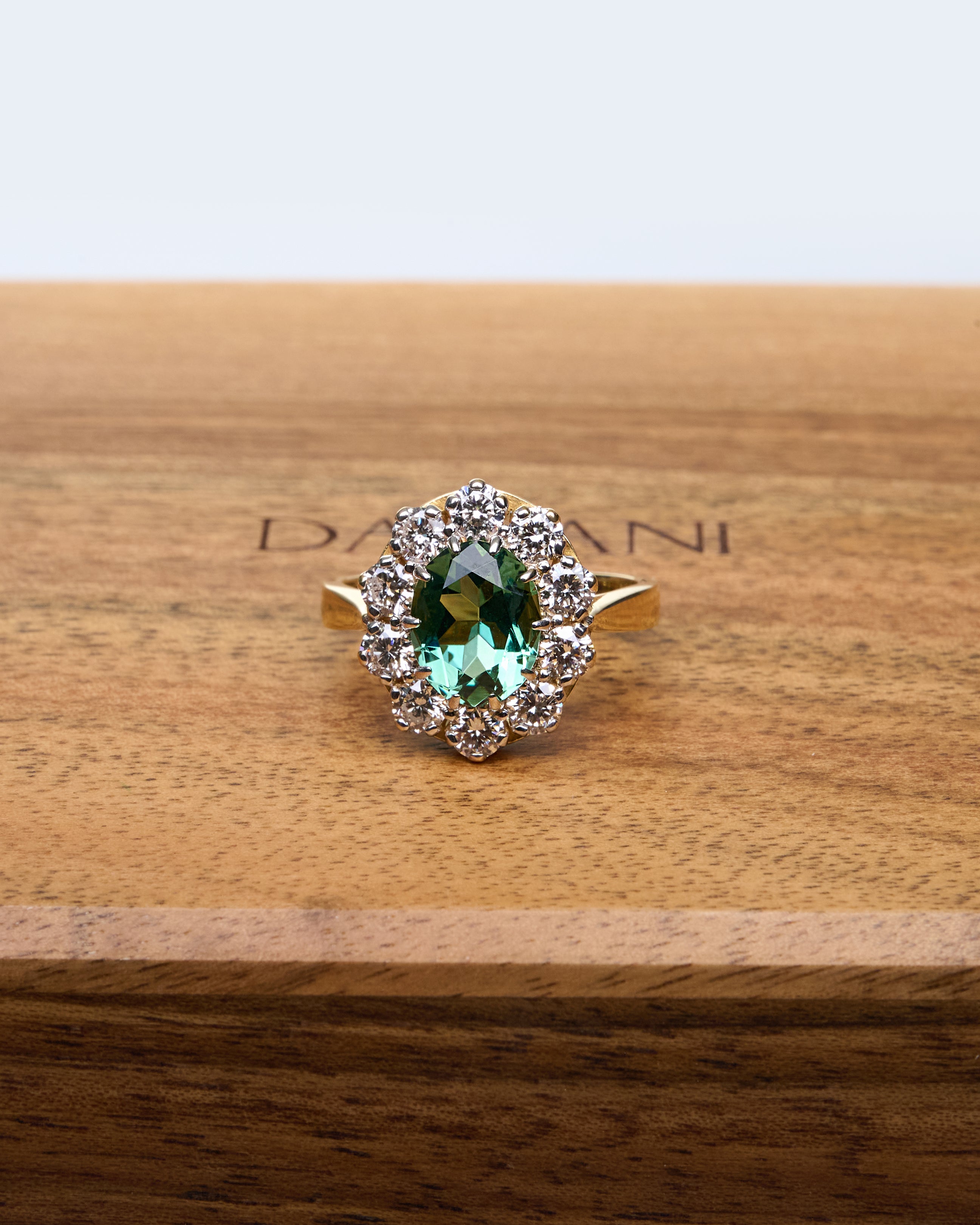Gold Ring with Oval Green Sapphire and Round Diamonds