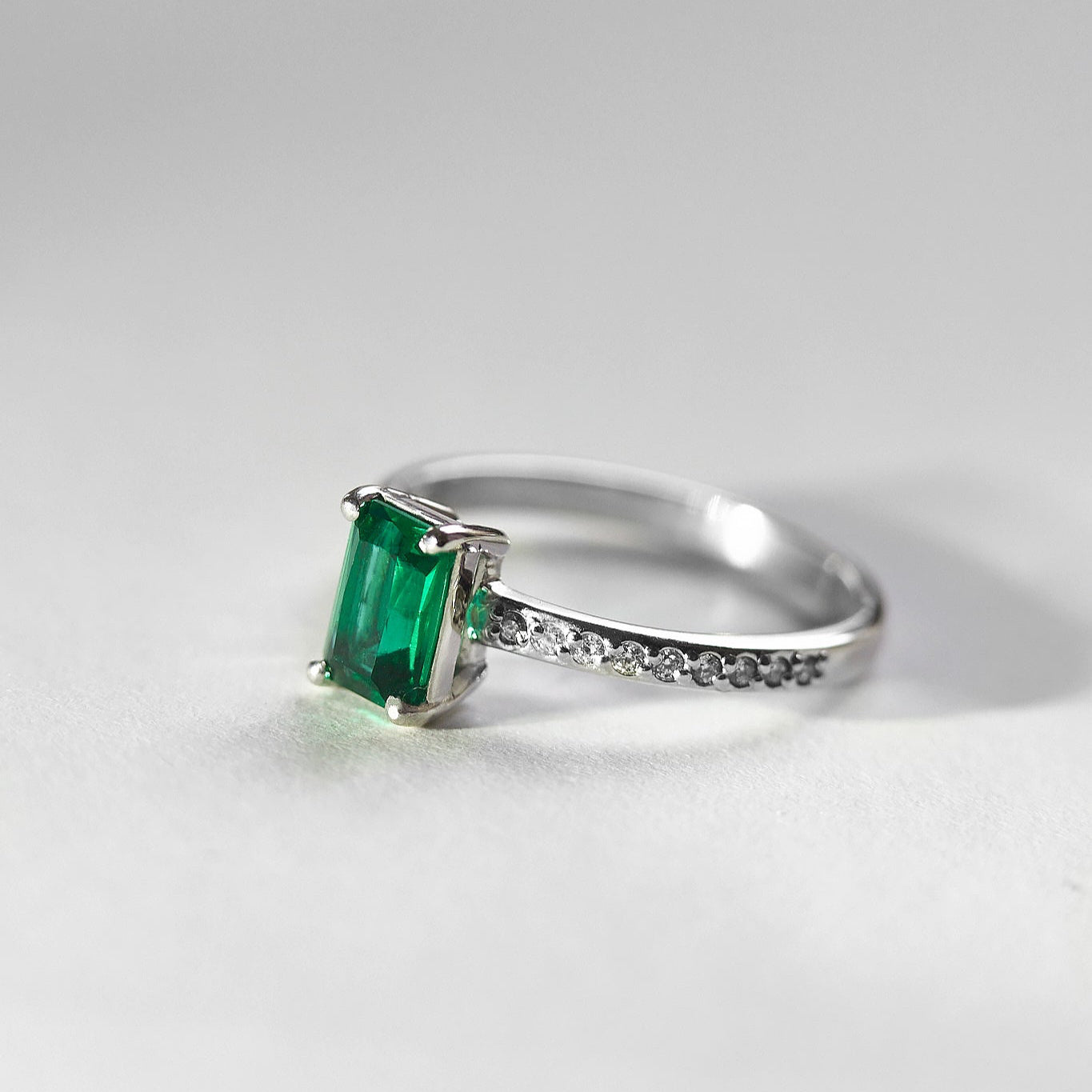 Gold Ring with Emerald cut Emerald and Diamonds