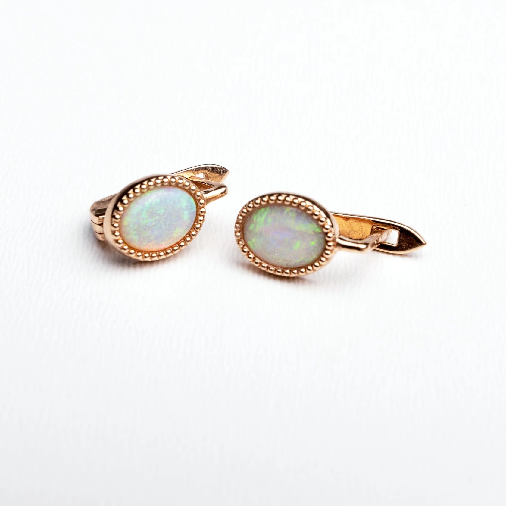 Gold Earrings with Oval cut Opals